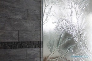 Pine cast / slump glass shower panel - A lot of people like to personalize their homes to fit their surrounding. This home was surrounded by beautiful pine trees.