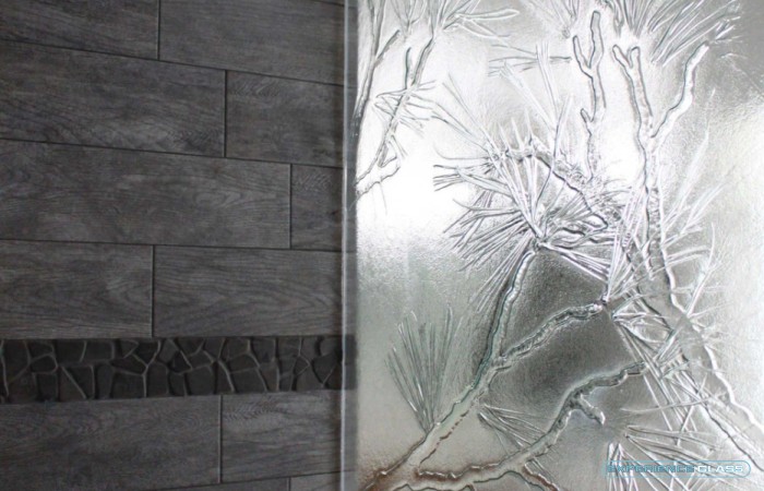 Pine cast / slump glass shower panel - A lot of people like to personalize their homes to fit their surrounding. This home was surrounded by beautiful pine trees.